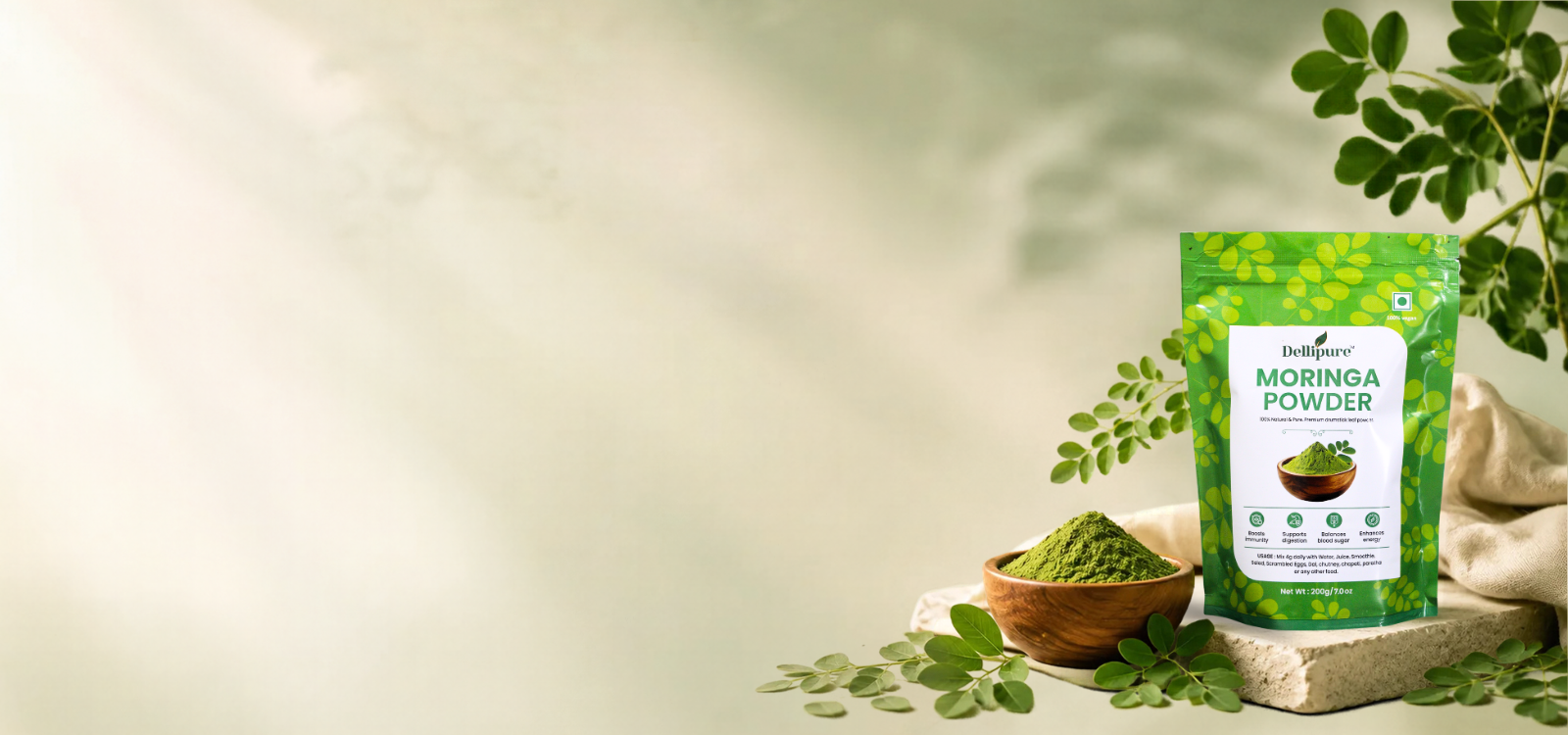 Dellipure moringa powder pouch with fresh moringa leaves